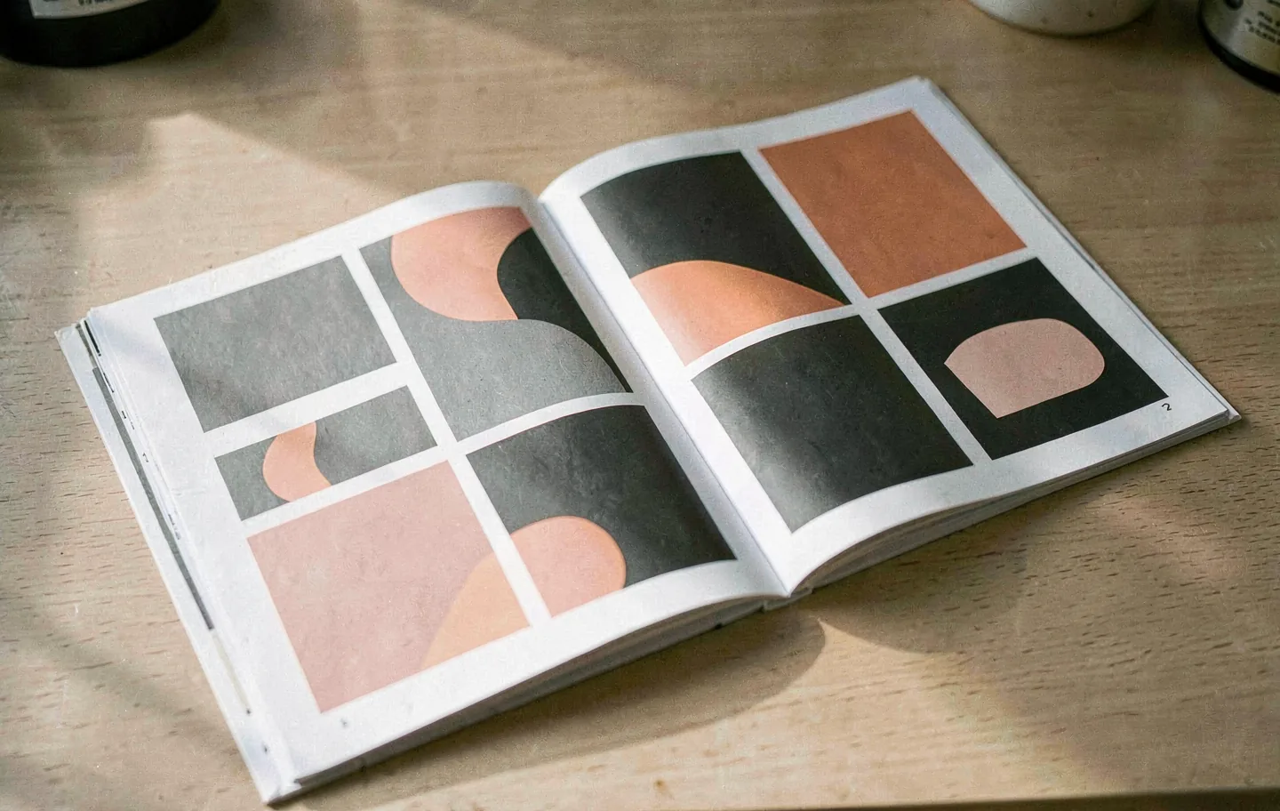 An open printed report with a confident grid of colour plates