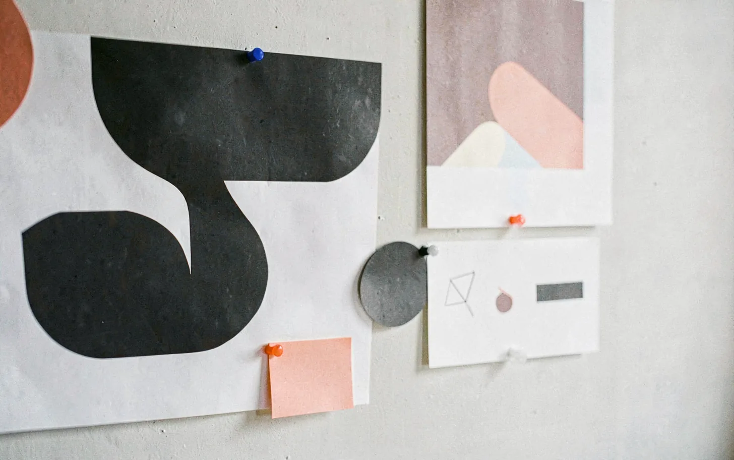 A complete identity system pinned to a studio wall