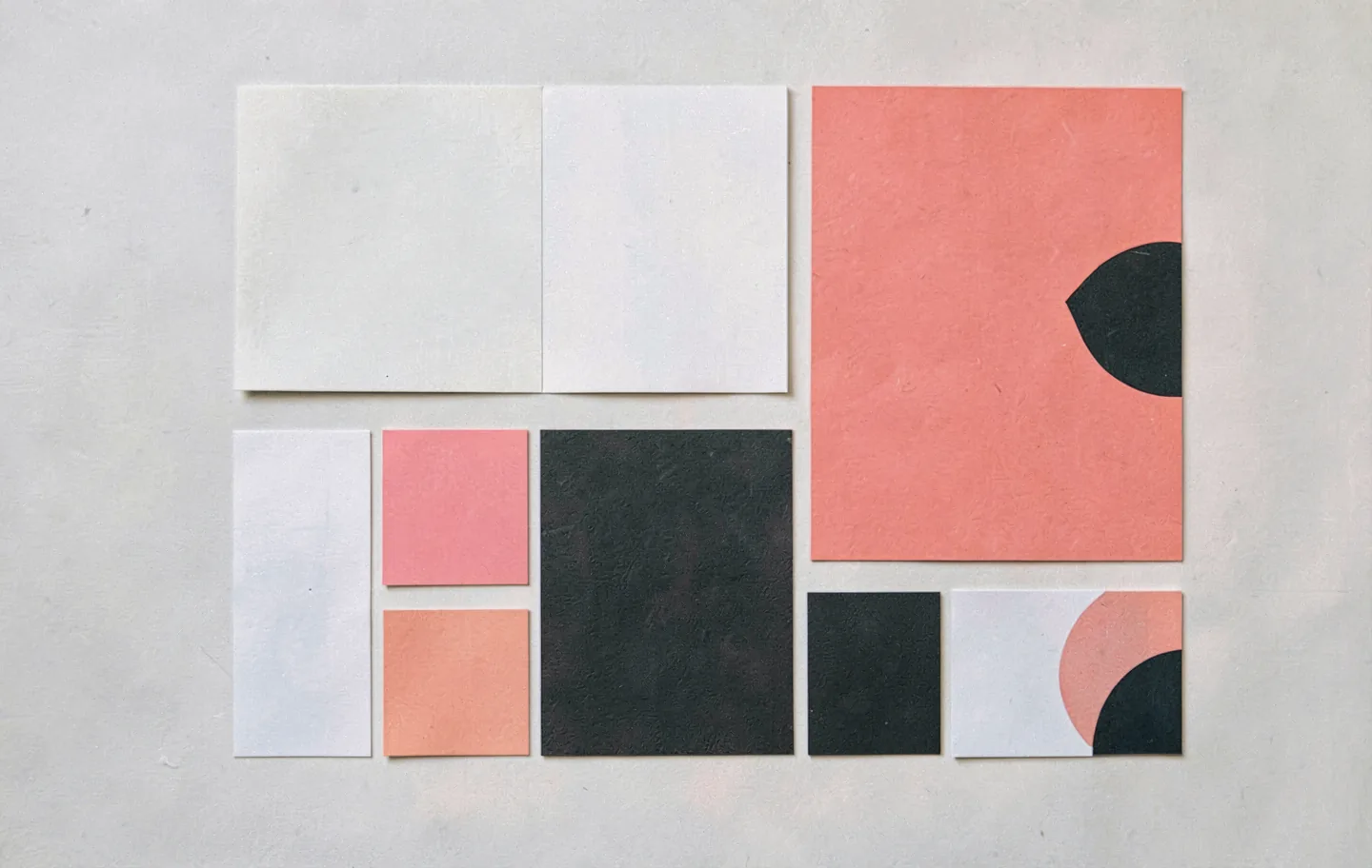 A brand system laid out across blank cards and colour chips