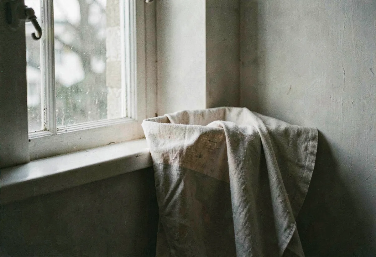 Folded linen catching a north window