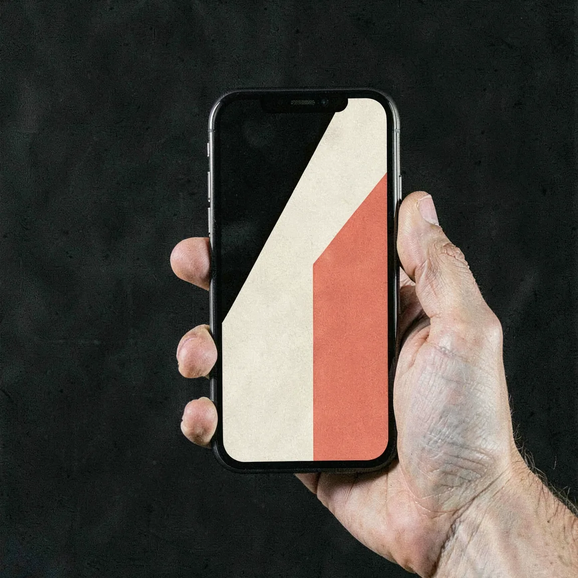 An app design with bold abstract artwork on a phone held in hand