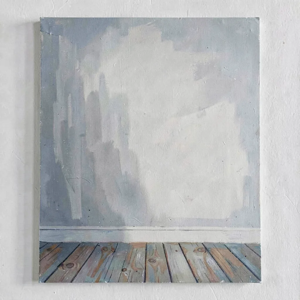 A study of a white wall meeting a wooden floor