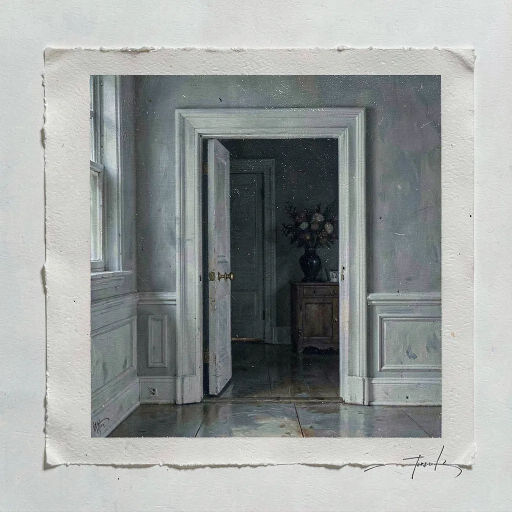 A doorway opening onto a darker room