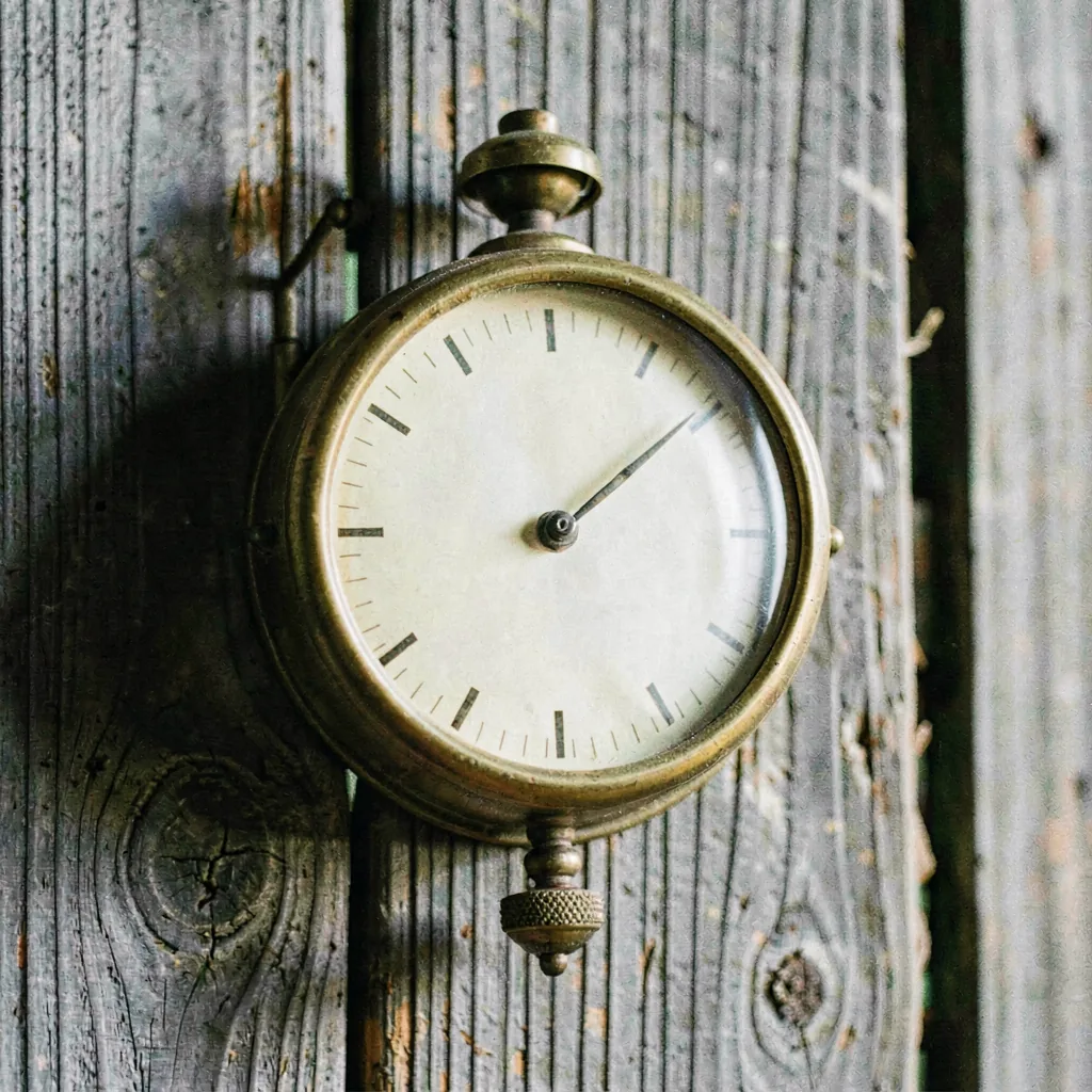 A wall barometer with an engraved dial
